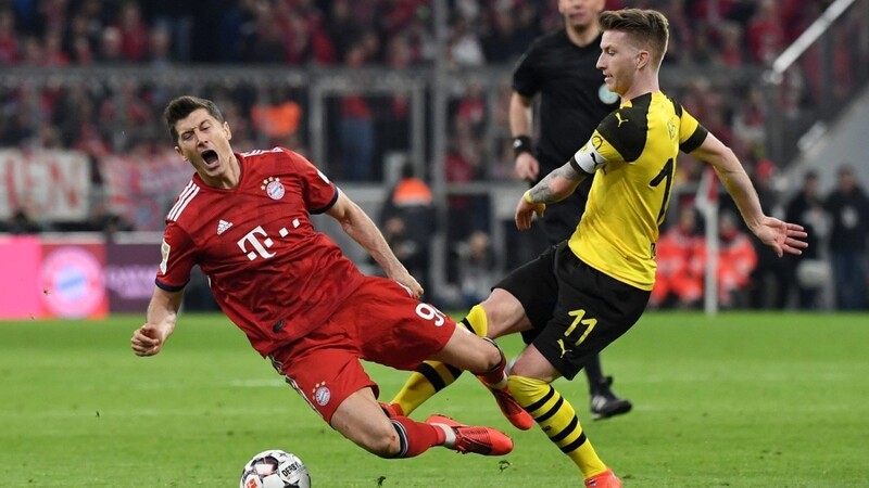 Zweikampf um den Titel? Dortmund mit Marco Reus (r.) gegen den FC Bayern um Robert Lewandowski.