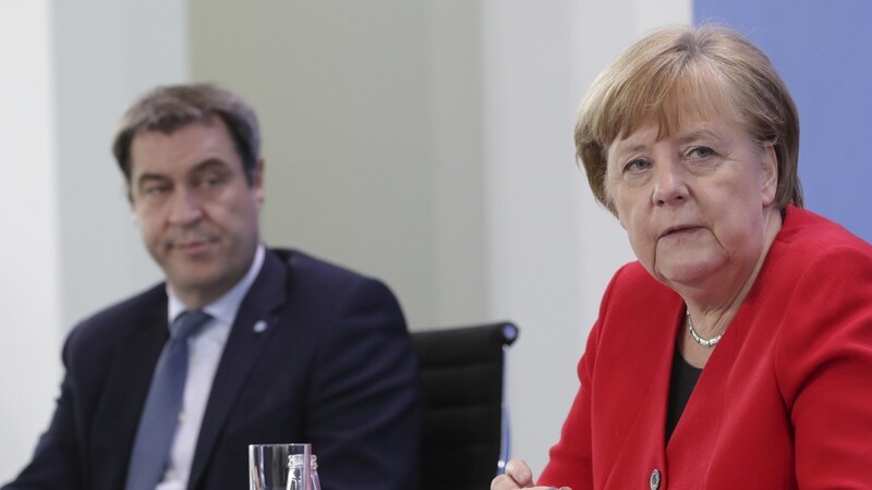 Bundeskanzlerin Angela Merkel und Bayerns Ministerpräsident Markus Söder lockern in der Corona-Krise die Zügel.
