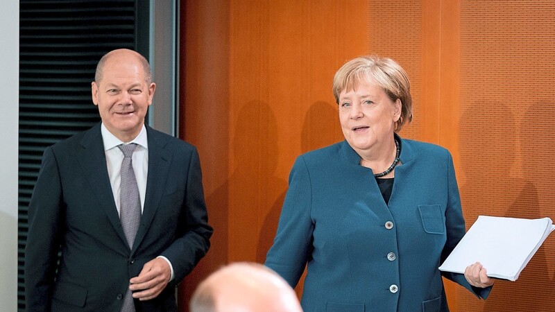 Als "arbeitsfähig und arbeitswillig" präsentieren Angela Merkel und Olaf Scholz die große Koalition.