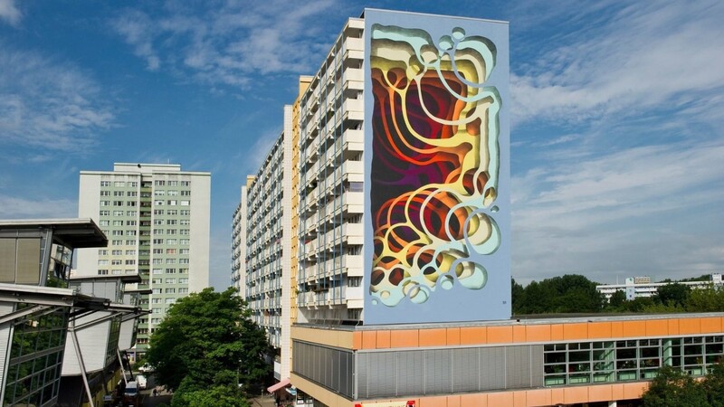 Der Hamburger Künstler 1010 hat es weltweit auf Häuserwände abgesehen. Seine Tropfen und Ringe an der Berliner Erich-Kurz-Straße sind tatsächlich nur gemalt. Ehrlich.