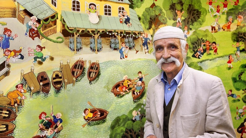 Vater des Kinder-Wimmelbuchs: Ali Mitgutsch vor einem seiner berühmten Bilder