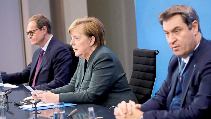 Der Lockdown wird wohl bis Ende Februar verlängert. Zumindest in diesem Punkt sind sich Kanzlerin Angela Merkel (M.), Berlins Regierender Bürgermeister und Vorsitzender der Ministerpräsidentenkonferenz, Michael Müller (l.), und CSU-Vorsitzender Markus Söder einig.