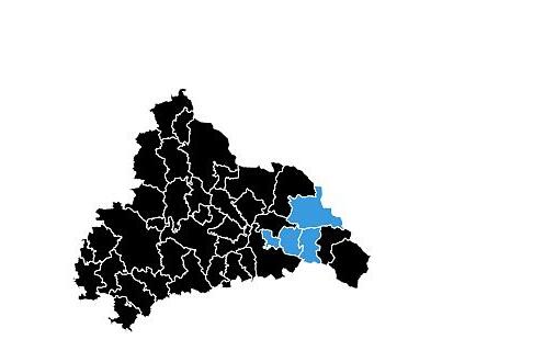 Die schwarze Landkreiskarte mit vier blauen Tupfern