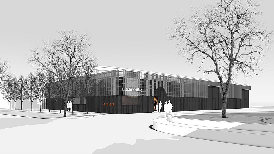 So soll die neue Fassadengestaltung der Drachenhöhle auf der Festwiese aussehen (Blick aus Richtung der ehemaligen Festhalle). Der Hauptzugang soll einem Höhleneingang gleichen. Die Toilettenanlage ist an der nordwestlichen Ecke geplant. So soll die neue Fassadengestaltung der Drachenhöhle auf der Festwiese aussehen (Blick aus Richtung der ehemaligen Festhalle). Der Hauptzugang soll einem Höhleneingang gleichen. Die Toilettenanlage ist an der nordwestlichen Ecke geplant.