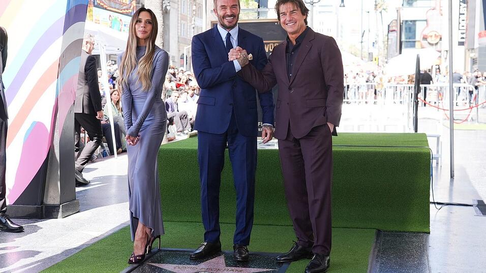 Victoria Beckham, David Beckham und Tom Cruise posierten auf dem Hollywood Walk of Fame vor David Beckhams neuem Stern.