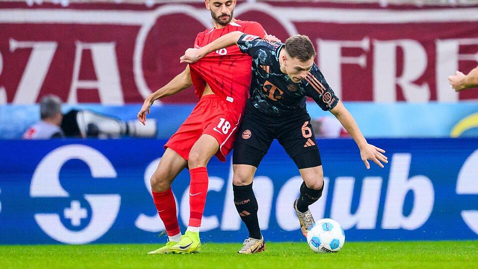 Joshua Kimmich, hier bedrängt von Freiburgs Eren Dinkci, war mit dem Bayern-Auftritt zufrieden. Joshua Kimmich, hier bedrängt von Freiburgs Eren Dinkci, war mit dem Bayern-Auftritt zufrieden.