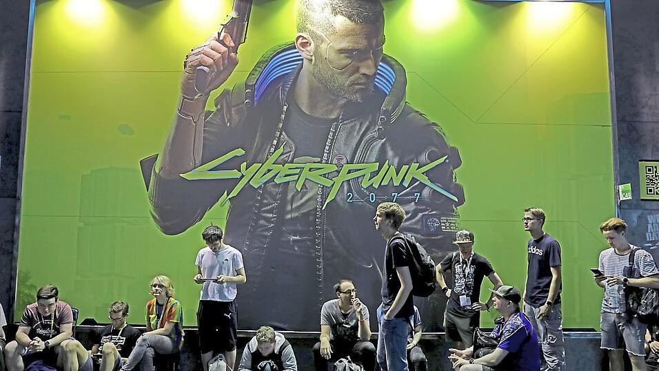 Schon am ersten Gamescom-Tag standen die Spielerbei 'Cyberpunk 2077' an. Foto: Oliver Berg/dpa Schon am ersten Gamescom-Tag standen die Spielerbei 'Cyberpunk 2077' an. Foto: Oliver Berg/dpa
