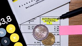 In den Koalitionsverhandlungen von Union und SPD dürfte die Frage nach dem Soli spannend werden.