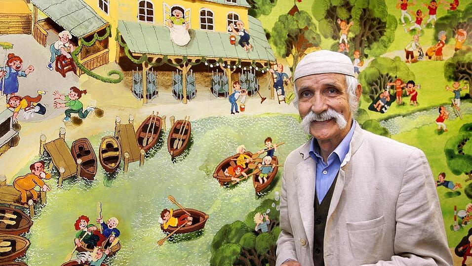 Vater des Kinder-Wimmelbuchs: Ali Mitgutsch vor einem seiner ber&uuml;hmten Bilder