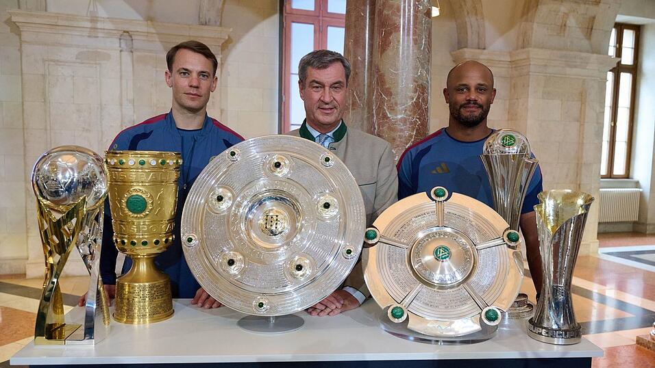 Der FC Bayern und Ministerpräsident Markus Söder (M) werben für Olympia. Der FC Bayern und Ministerpräsident Markus Söder (M) werben für Olympia.