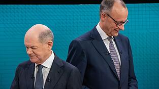 Es kann nur einen geben: Zusammen wollen Friedrich Merz (CDU) und Olaf Scholz (SPD) nicht in ein Kabinett. Zu einer Koalition ihrer Parteien könnte es trotzdem kommen. (Archivbild)