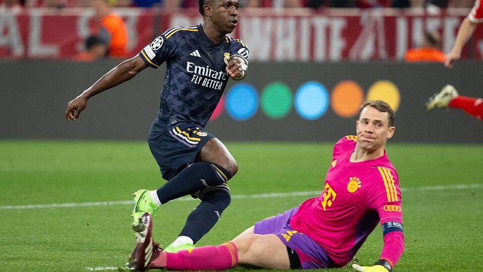 Brisantes Wiedersehen: Real-Star Vin&iacute;cius J&uacute;nior und Bayern-Torwart Manuel Neuer. (Archivbild)