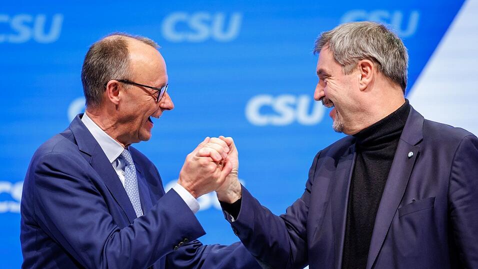 Die Chefs von CSU und CDU, Markus S&ouml;der und Friedrich Merz, setzen auf Geschlossenheit im Wahlkampf.