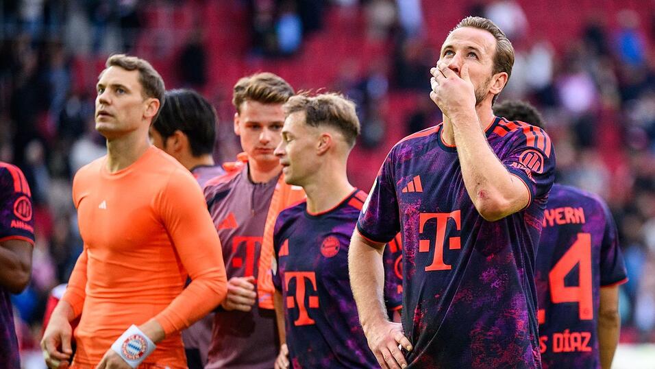 So hatten sich die Bayern um Torhüter Neuer (l) und Stürmerstar Kane (r) die Generalprobe für die Champions-League-Reise nach Stavanger nicht vorgestellt. So hatten sich die Bayern um Torhüter Neuer (l) und Stürmerstar Kane (r) die Generalprobe für die Champions-League-Reise nach Stavanger nicht vorgestellt.