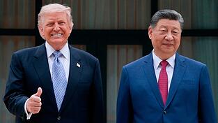 US-Präsident Donald Trump betonte die Handels-Erfolge seiner Reise nach China. Peking bleibt etwas zurückhaltender. US-Präsident Donald Trump betonte die Handels-Erfolge seiner Reise nach China. Peking bleibt etwas zurückhaltender.