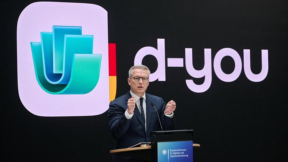 Wer sein Smartphone ab dem kommenden Jahr auch als Ausweis nutzen will, braucht dafür eine App namens 'd-you'. Bundesdigitalminister Karsten Wildberger (CDU) stellt Name und Design der Anwendung vor. Wer sein Smartphone ab dem kommenden Jahr auch als Ausweis nutzen will, braucht dafür eine App namens 'd-you'. Bundesdigitalminister Karsten Wildberger (CDU) stellt Name und Design der Anwendung vor.