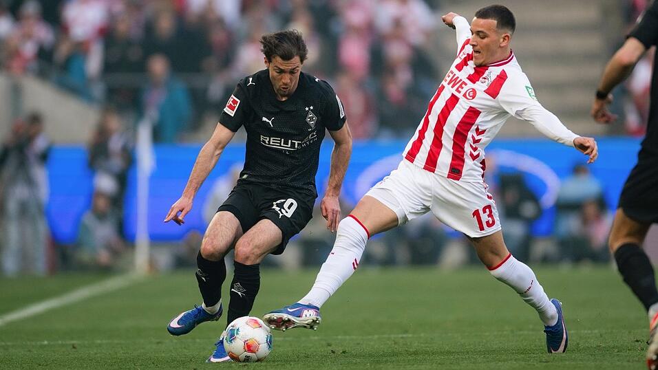 Rivalen am Rhein: Kölns Torschütze Said El Mala (r) im Zweikampf mit dem Gladbacher Joe Scally. Rivalen am Rhein: Kölns Torschütze Said El Mala (r) im Zweikampf mit dem Gladbacher Joe Scally.