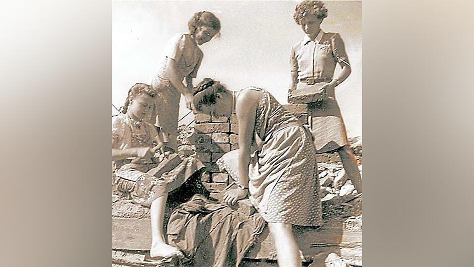 Kinder holen Hausbau-Material.