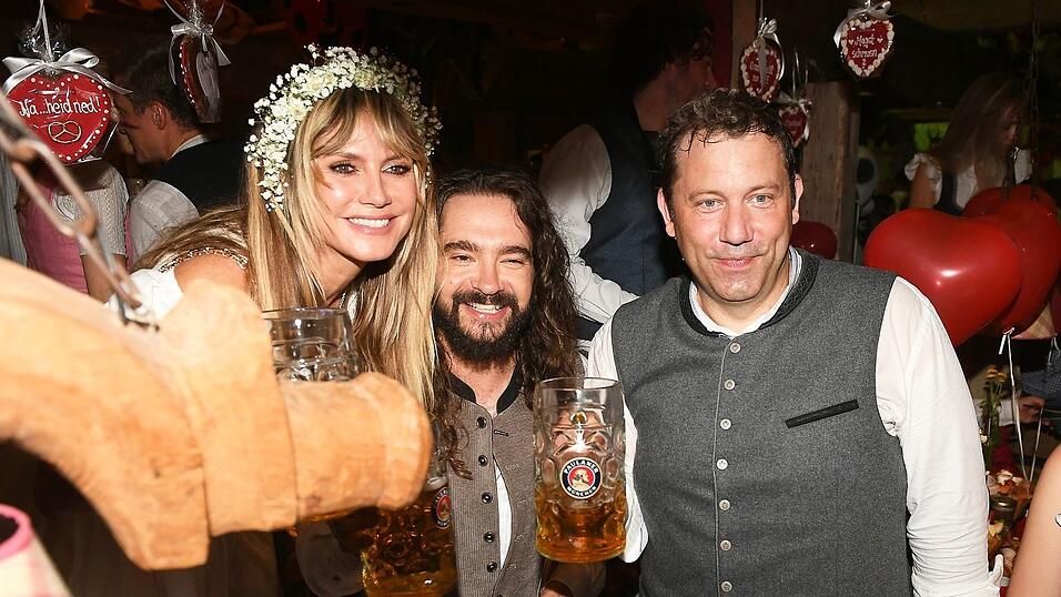 Regelmäßig feiern auf der Wiesn auch viele Prominente - im vergangenen Jahr zum Beispiel Heidi Klum, Tom Kaulitz und Lars Klingbeil (r). Regelmäßig feiern auf der Wiesn auch viele Prominente - im vergangenen Jahr zum Beispiel Heidi Klum, Tom Kaulitz und Lars Klingbeil (r).