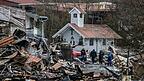 Trümmer liegen nach einem Großbrand auf dem Gelände der Westernstadt «Pullman City».
