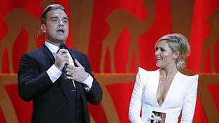 In der Gegenwart von Helene Fischer fühlt sich Robbie Williams wohl. In der Gegenwart von Helene Fischer fühlt sich Robbie Williams wohl.